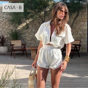 5⭐️CASA B | Christy Twist Front Cropped Plunge Front Pocket Blouse